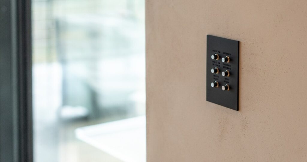 A button panel installed seamlessly into the wall of a home.