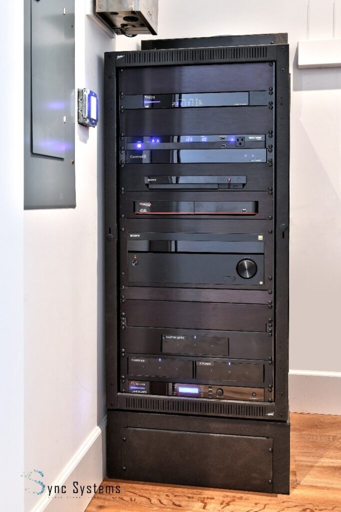 A custom completely finished AV cabinet for organizing audio and visual systems.