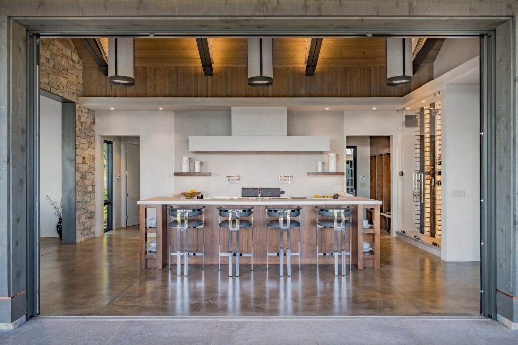 A modern designed kitchen with subtly integrated smart home features.