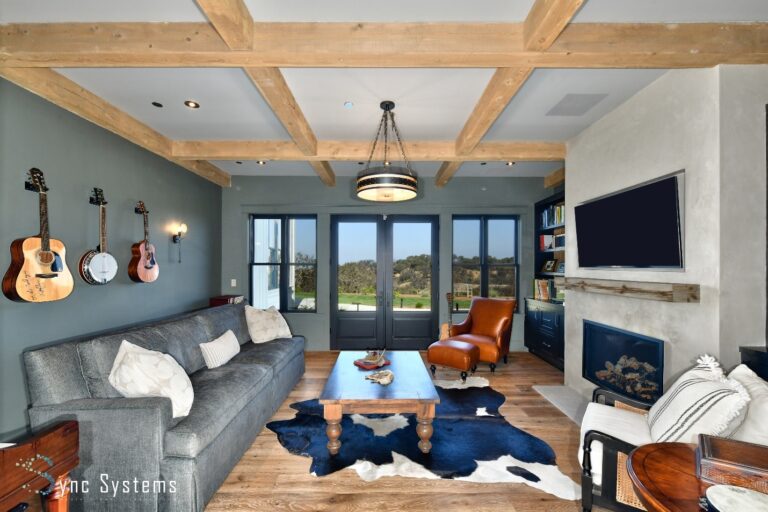 A modern living room with an integrated TV and sound system.