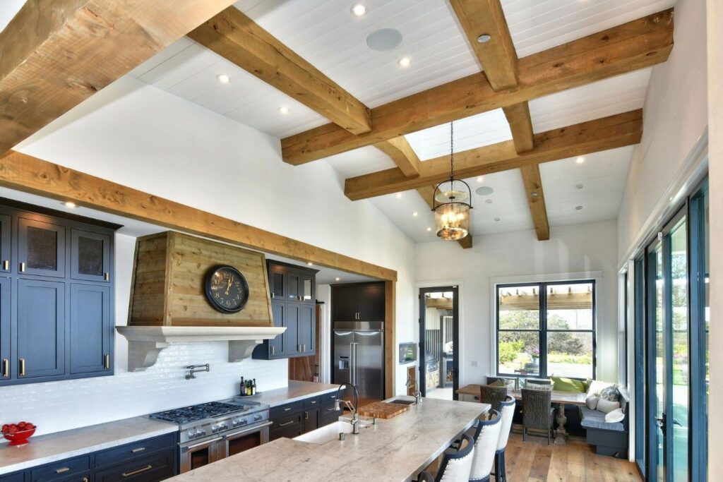 A large, modern kitchen with AV installations including lighting and speakers.