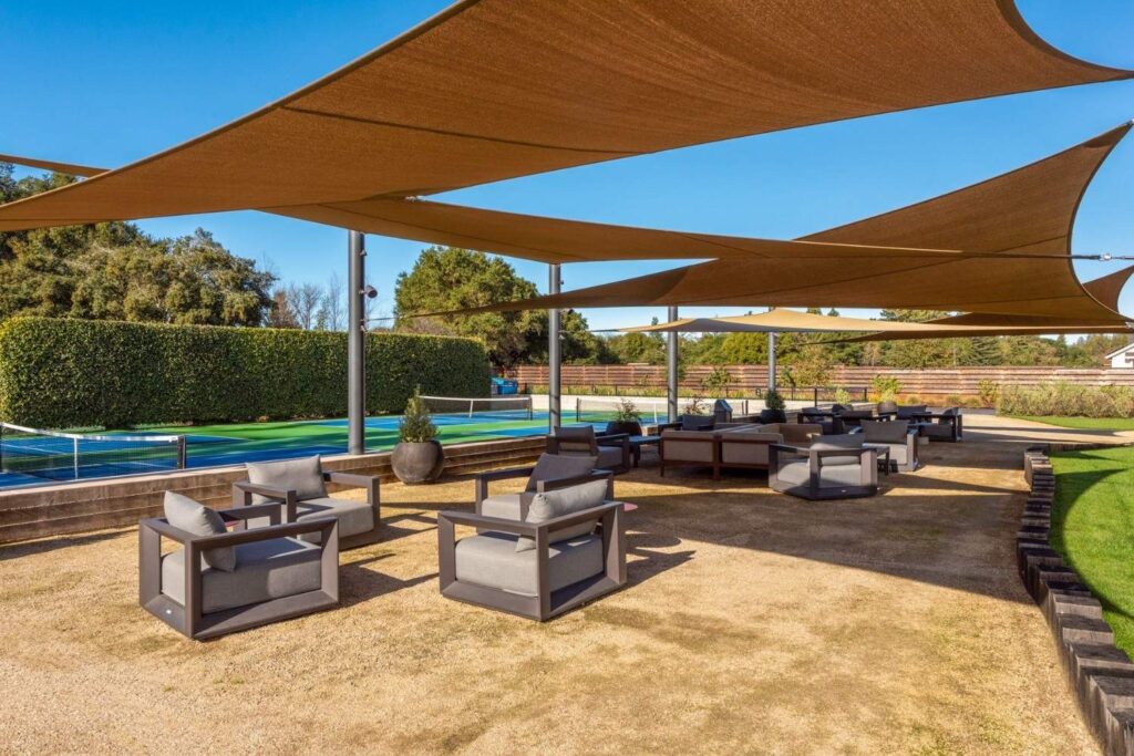 A lounge area by commercial tennis courts with modern AV installations.